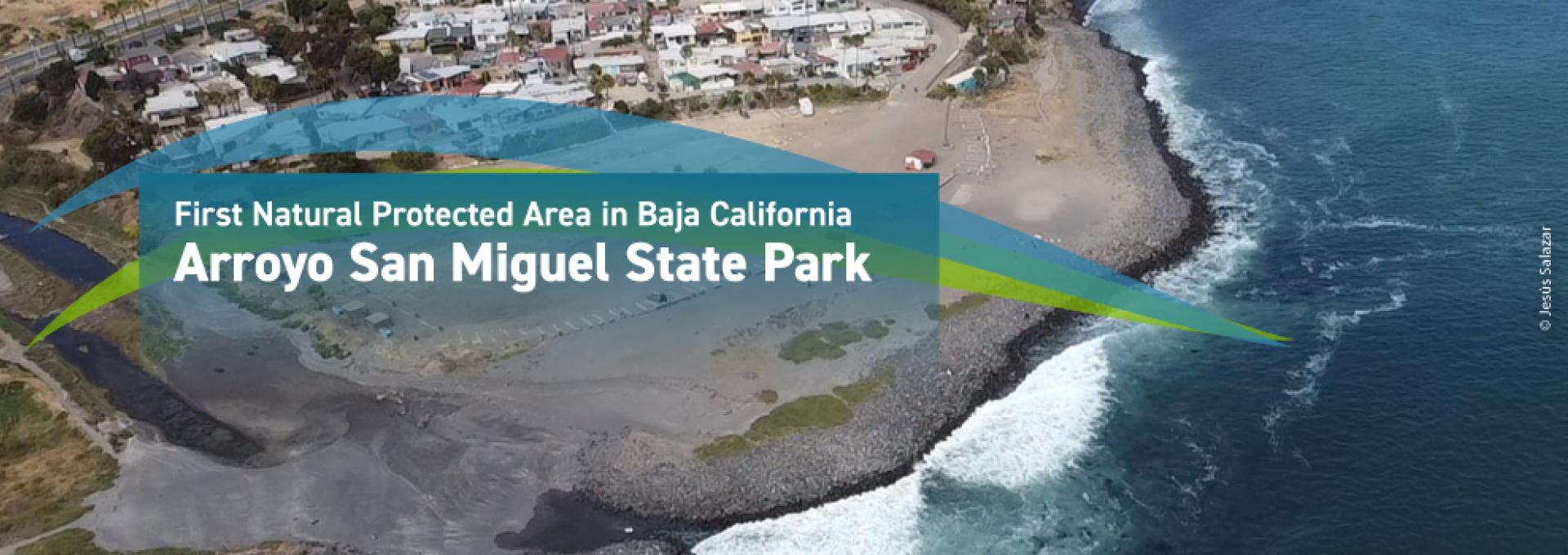 Aereal picture of San Miguel Beach with caption "First Natural Protected Area in Baja California, Arroyo San Miguel State Park"